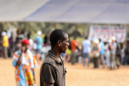OUIDAH, BENIN - Jan 10, 2017: Unidentified Beninese man in dark clothes at the voodoo festival, which is anually celebrated on January, 10th.のeditorial素材