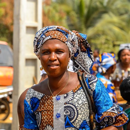 OUIDAH, BENIN - Jan 10, 2017: Unidentified Beninese woman in national suit smiles at the voodoo festival, which is anually celebrated on January, 10th.のeditorial素材