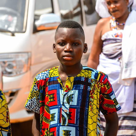 OUIDAH, BENIN - Jan 10, 2017: Unidentified Beninese  little boy in colored shirt with big lips at the voodoo festival, which is anually celebrated on January, 10th.のeditorial素材