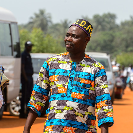 OUIDAH, BENIN - Jan 10, 2017: Unidentified Beninese man in colored shirt with mustaches looks away at the voodoo festival, which is anually celebrated on January, 10th.のeditorial素材