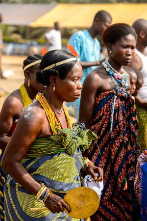 OUIDAH, BENIN - Jan 10, 2017: Unidentified Beninese woman in national clothes wears earings and necklace at the voodoo festival, which is anually celebrated on January, 10th.のeditorial素材