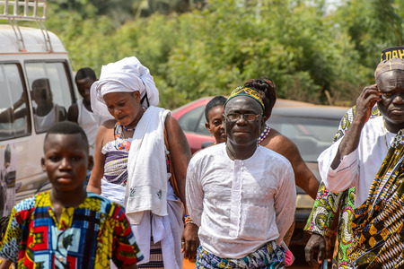 OUIDAH, BENIN - Jan 10, 2017: Unidentified Beninese people of different age walk at the voodoo festival, which is anually celebrated on January, 10th.のeditorial素材