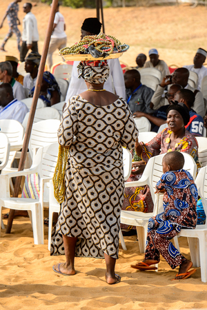 OUIDAH, BENIN - Jan 10, 2017: Unidentified Beninese people from behind at the voodoo festival, which is anually celebrated on January, 10th.のeditorial素材