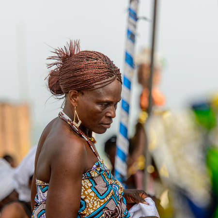 OUIDAH, BENIN - Jan 10, 2017: Unidentified Beninese woman wears earings and necklace at the voodoo festival, which is anually celebrated on January, 10th.のeditorial素材
