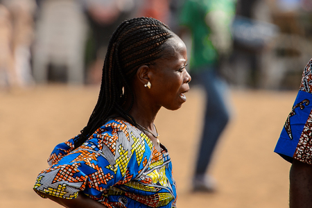 OUIDAH, BENIN - Jan 10, 2017: Unidentified Beninese woman with braids at the voodoo festival, which is anually celebrated on January, 10th.のeditorial素材