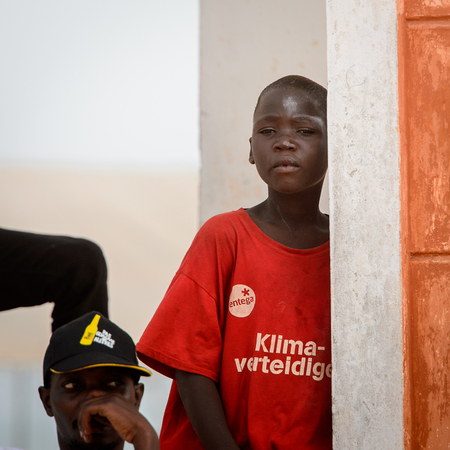 OUIDAH, BENIN - Jan 10, 2017: Unidentified Beninese  little boy leans on the wall at the voodoo...