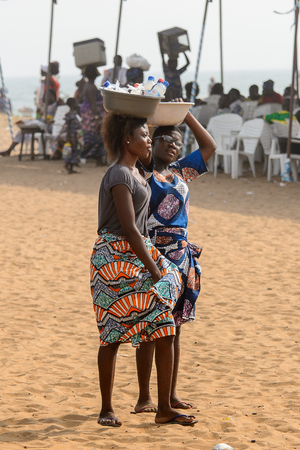 OUIDAH, BENIN - Jan 10, 2017: Unidentified Beninese women with basins at the voodoo festival, which is anually celebrated on January, 10th.のeditorial素材