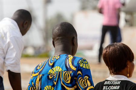 OUIDAH, BENIN - Jan 10, 2017: Unidentified Beninese people from behind at the voodoo festival, which is anually celebrated on January, 10th.のeditorial素材