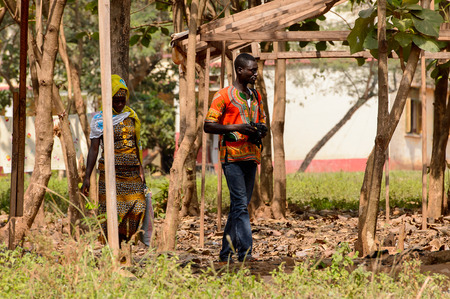 CENTRAL REGION, GHANA - Jan 17, 2017: Unidentified Ghanaian people walk through the garden in local village. People of Ghana suffer of poverty due to the bad economyのeditorial素材