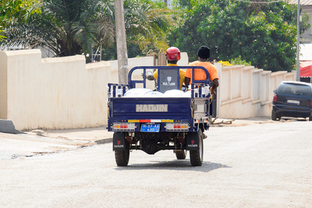 CENTRAL REGION, GHANA - Jan 17, 2017: Unidentified Ghanaian man drives tricycle in local village....
