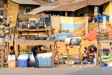 CENTRAL REGION, GHANA - Jan 17, 2017: Unidentified Ghanaian people sell goods on the market in local village. People of Ghana suffer of poverty due to the bad economyのeditorial素材