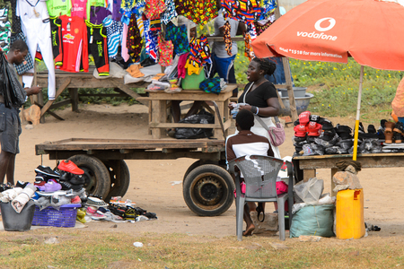 ELMINA, GHANA -JAN 18, 2017: Unidentified  Ghanaian people sell goods in Elmina. People of Ghana suffer of poverty due to the bad economyのeditorial素材
