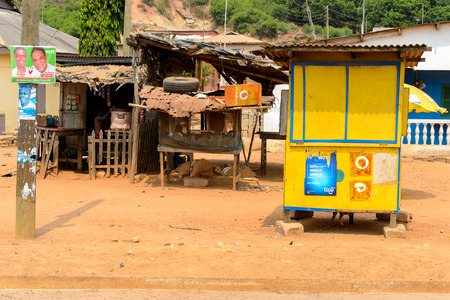 CENTRAL REGION, GHANA - Jan 17, 2017: Unidentified Ghanaian little boy holds on the plastic box in local village. Children of Ghana suffer of poverty due to the bad economyのeditorial素材