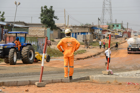 CENTRAL REGION, GHANA - Jan 17, 2017: Unidentified Ghanaian man in uniform from behind in local village. People of Ghana suffer of poverty due to the bad economyのeditorial素材