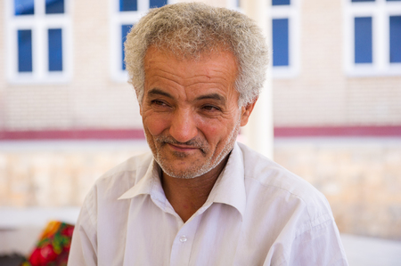 SAMARKAND, UZBEKISTAN - JUNE 10, 2011: Unidentified Uzbek man smiles for the camera in Uzbekistan, Jun 10, 2011.  81% of people in Uzbekistan belong to Uzbek ethnic groupのeditorial素材