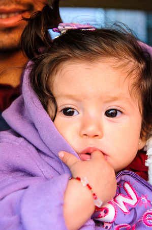 MEXICO CITY, MEXICO - DEC 29, 2011: Unidentified Mexican little girl portrait. 60% of Mexican people...