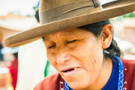 PERU - NOVEMBER 6, 2010: Unidentified Peruvian woman in traditional hat work at the local market in Peru, Nov 6, 2010. Over 50 per cent of people in Peru live below the the poverty line.のeditorial素材