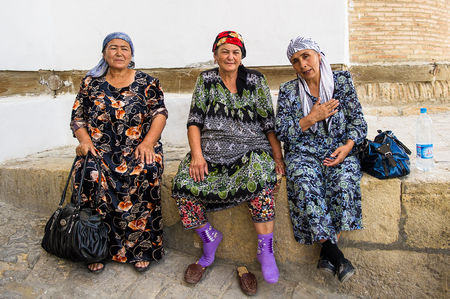 UZBEKISTAN - JUNE 7, 2011: Unidentified Uzbek women sit on a bench and talk of something in Uzbekistan, Jun 7, 2011.  81% of people in Uzbekistan belong to Uzbek ethnic groupのeditorial素材