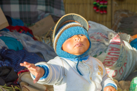 PERU - NOVEMBER 7, 2010: Unidentified Peruvian boy tries to get the camera in Peru, Nov 7, 2010. Over 50 per cent of people in Peru live below the the poverty line.のeditorial素材