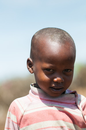AMBOSELI, KENYA - OCTOBER 10, 2009: Portrait of an unidentified Massai little girl in Kenya, Oct 10, 2009. Massai people are a Nilotic ethnic groupのeditorial素材