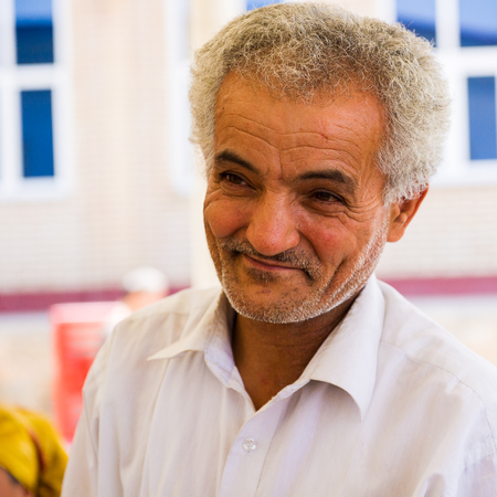 SAMARKAND, UZBEKISTAN - JUNE 10, 2011: Unidentified Uzbek man smiles for the camera in Uzbekistan, Jun 10, 2011.  81% of people in Uzbekistan belong to Uzbek ethnic groupのeditorial素材