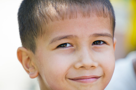 TASHKENT, UZBEKISTAN - JUNE 12, 2011: Portrait of an unidentified Uzbek boy in Uzbekistan, Jun 12, 2011. 93% of Uzbek people consider that life in the country goes wellのeditorial素材