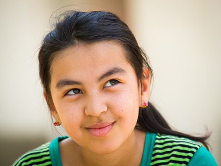 TASHKENT, UZBEKISTAN - JUNE 12, 2011: Unidentified Uzbek girl in Uzbekistan, Jun 4, 2011. 93% of Uzbek people consider that life in the country goes wellのeditorial素材