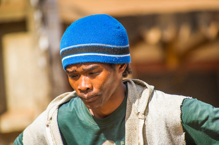 MADAGASCAR - JUNE 30, 2011: Portrait of an unidentified Madagascar market seller in Madagascar, June 30, 2011. People of Madagascar suffer of poverty due to the unstable situation.のeditorial素材
