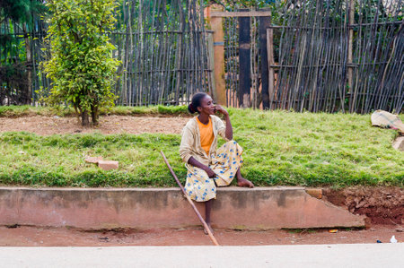 ANTANANARIVO, MADAGASCAR - JUNE 30, 2011: Unidentified Madagascar girl sits and thinks. People in Madagascar suffer of poverty due to the slow development of the countryのeditorial素材