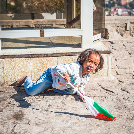 ANTANANARIVO, MADAGASCAR - JUNE 27, 2011: Unidentified Madagascar girl smiles and poses for camera. People in Madagascar suffer of poverty due to the slow development of the countryのeditorial素材