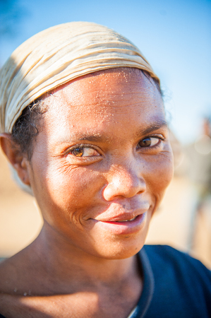 MADAGASCAR - JUNE 30, 2011: Portrait of an unidentified Madagascar woman in a white tissue Madagascar, June 30, 2011. People of Madagascar suffer of poverty due to the unstable situation.のeditorial素材
