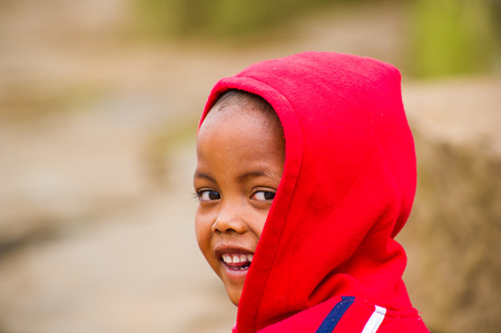 MADAGASCAR - JUNE 29, 2011: Portrait of an unidentified Madagascar girl in Madagascar, June 29, 2011. Children of Madagascar suffer of poverty due to the unstable situation.のeditorial素材