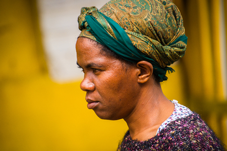 MADAGASCAR - JUNE 29, 2011: Portrait of an unidentified Madagascar lady in a tissue in Madagascar, June 29, 2011. People of Madagascar suffer of poverty due to the unstable situation.のeditorial素材