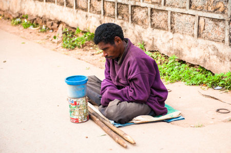 ANTANANARIVO, MADAGASCAR - JUNE 30, 2011: Unidentified Madagascar misary man in the street. People in Madagascar suffer of poverty due to the slow development of the countryのeditorial素材