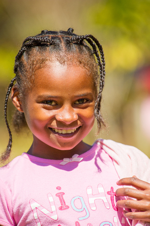 MADAGASCAR - JUNE 27, 2011: Unidentified Madagascarian girl smiles for the camera in Madagascar, June 27, 2011. Children of Madagascar suffer of poverty due to the unstable situation.のeditorial素材