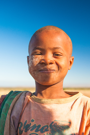 MADAGASCAR - JULY 3, 2011: Portrait of an unidentified smiling boy in Madagascar, July 3, 2011. Children of Madagascar suffer of poverty due to the unstable situation.のeditorial素材