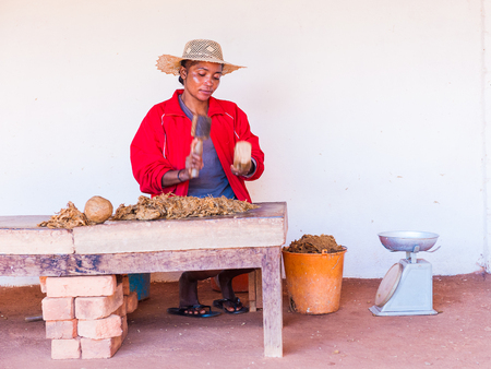 ANTANANARIVO, MADAGASCAR - JULY 1, 2011: Unidentified Madagascar woman sells stuff at the market. People in Madagascar suffer of poverty due to slow development of the countryのeditorial素材
