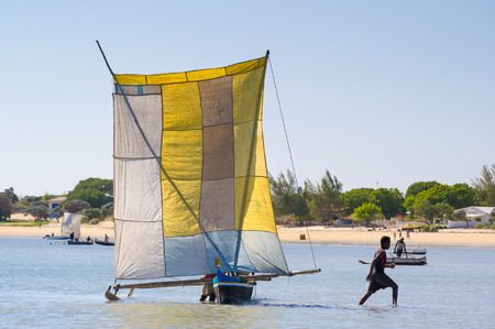 ANTANANARIVO, MADAGASCAR - JULY 3, 2011: Unidentified Madagascar people on a small boat. People in...