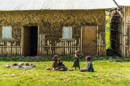 OMO, ETHIOPIA - SEPTEMBER 19, 2011: Unidentified Ethiopian children near their house. People in Ethiopia suffer of poverty due to the unstable situationのeditorial素材