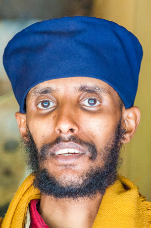 OMO VALLEY, ETHIOPIA - SEP 20, 2011: Portrait of an unidentified Ethiopian man with beard in a blue turban in Ethiopia, Sep.20, 2011. People in Ethiopia suffer of poverty due to the unstable situationのeditorial素材