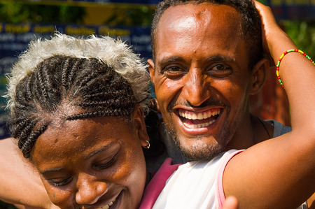 OMO, ETHIOPIA - SEPTEMBER 20, 2011: Unidentified Ethiopian woman hugs her close friend. People in...