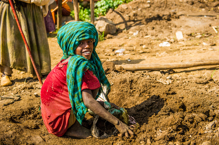 OMO, ETHIOPIA - SEPTEMBER 19, 2011: Unidentified Ethiopian boy in the street. People in Ethiopia suffer of poverty due to the unstable situationのeditorial素材