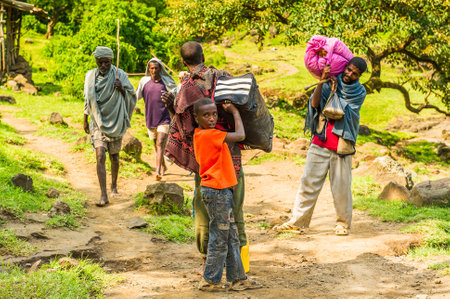 OMO, ETHIOPIA - SEPTEMBER 19, 2011: Unidentified Ethiopian people in the street. People in Ethiopia suffer of poverty due to the unstable situationのeditorial素材