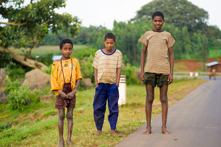 OMO, ETHIOPIA - SEPTEMBER 19, 2011: Unidentified Ethiopian children walk over the road. People in Ethiopia suffer of poverty due to the unstable situationのeditorial素材