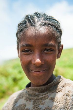 OMO VALLEY, ETHIOPIA - SEP 19, 2011: Portrait of an unidentified Ethiopian boy in Ethiopia, Sep.19, 2011. People in Ethiopia suffer of poverty due to the unstable situationのeditorial素材