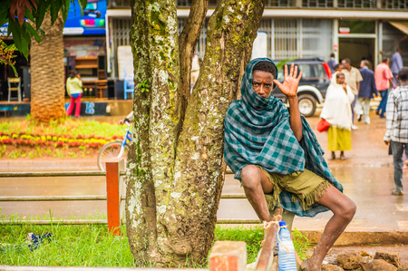 OMO, ETHIOPIA - SEPTEMBER 20, 2011: Unidentified Ethiopian man says hello. People in Ethiopia suffer of poverty due to the unstable situationのeditorial素材