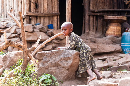 OMO, ETHIOPIA - SEPTEMBER 19, 2011: Unidentified Ethiopian girl in the street. People in Ethiopia suffer of poverty due to the unstable situationのeditorial素材