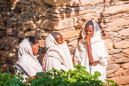 OMO, ETHIOPIA - SEPTEMBER 21, 2011: Unidentified Ethiopian women in white tissue. People in Ethiopia suffer of poverty due to the unstable situationのeditorial素材