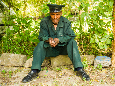 AKSUM, ETHIOPIA - SEPTEMBER 24, 2011: Unidentified Ethiopian man wearing military uniform. People in Ethiopia suffer of poverty due to the unstable situationのeditorial素材