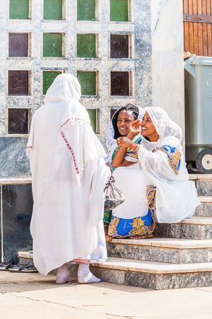 OMO, ETHIOPIA - SEPTEMBER 21, 2011: Unidentified Ethiopian women in a white tissues in the street. People in Ethiopia suffer of poverty due to the unstable situationのeditorial素材